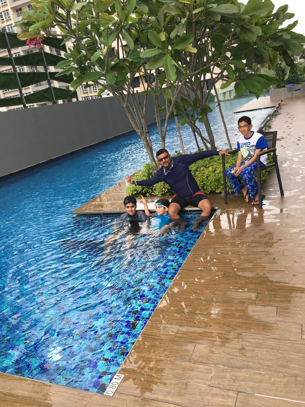 Coach Singh at the shallow end of a condominium pool
